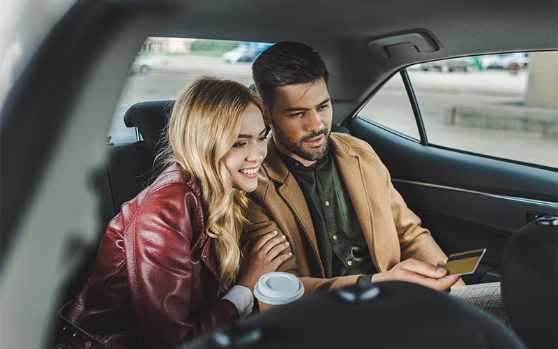 Customer Handing Over Card In Taxi Image