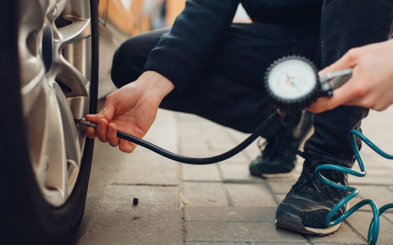 Tyre pressure being checked