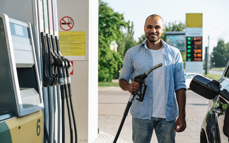 Man filling up car at petrol station