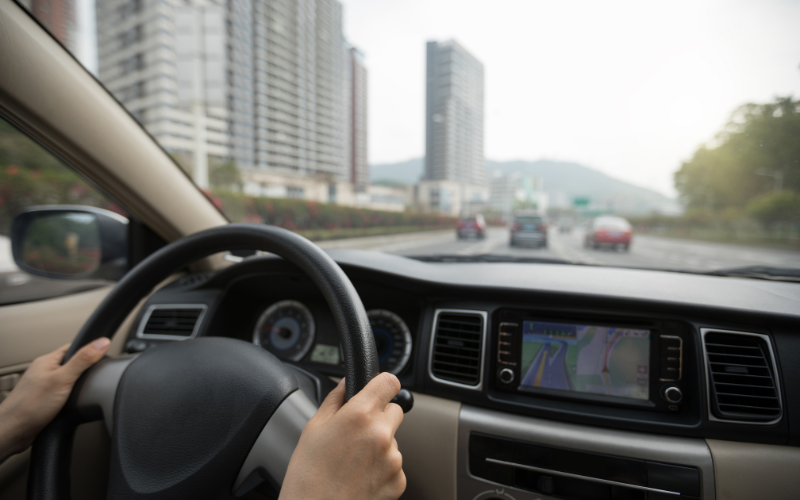 Driver using navigation system inside vehicle
