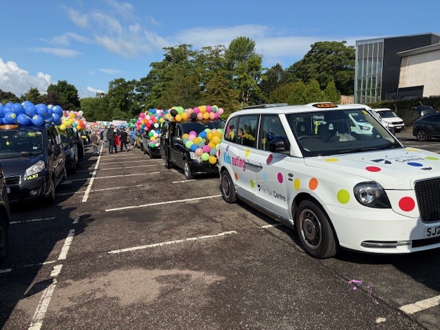 James and Jordan at Edinburgh Taxi Outing in a polka-dot LEVC